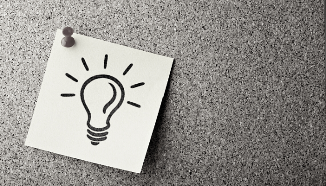 WC Blog_ ideas Post-it note on a pin board with a lightbulb drawing
